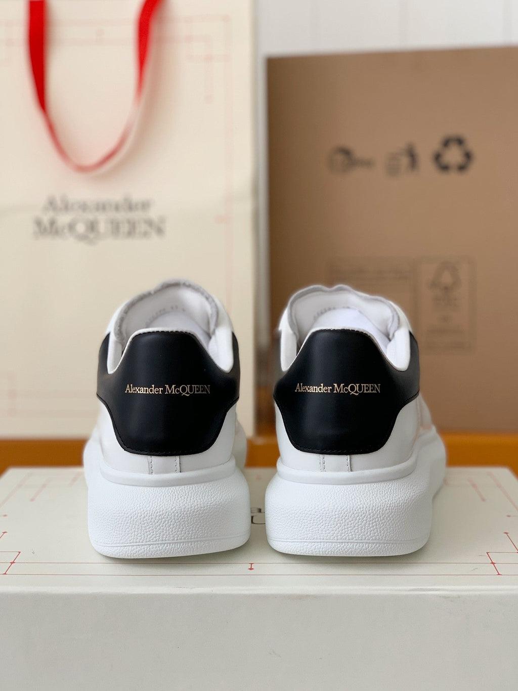 Alexander McQueen Men’s White Leather Oversized Sneakers with Black Heel Tab