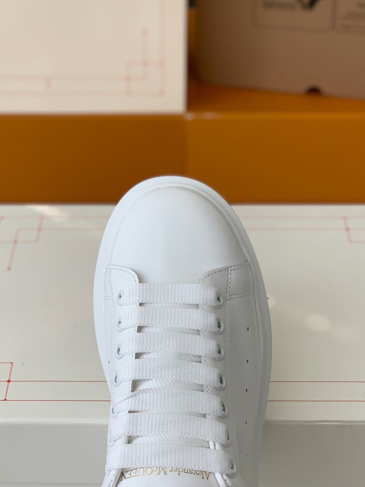 Alexander McQueen Men’s White Leather Oversized Sneakers with Black Heel Tab