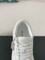 Amiri Skel Top Low – Triple White Grained Leather