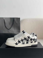 Amiri Star Burst Low – White Grained Leather & Black Stars