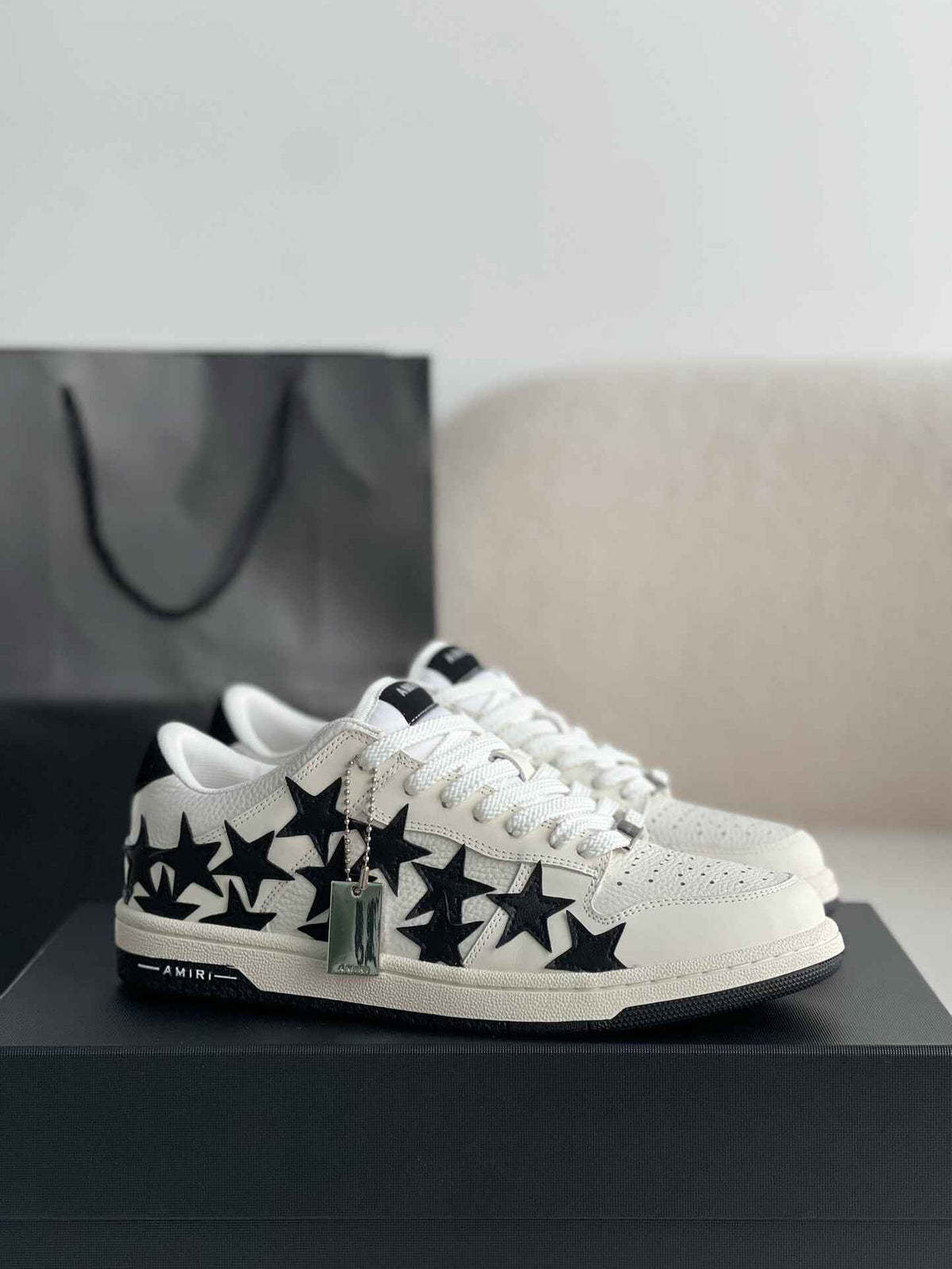 Amiri Star Burst Low – White Grained Leather & Black Stars