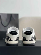 Amiri Star Burst Low – White Grained Leather & Black Stars
