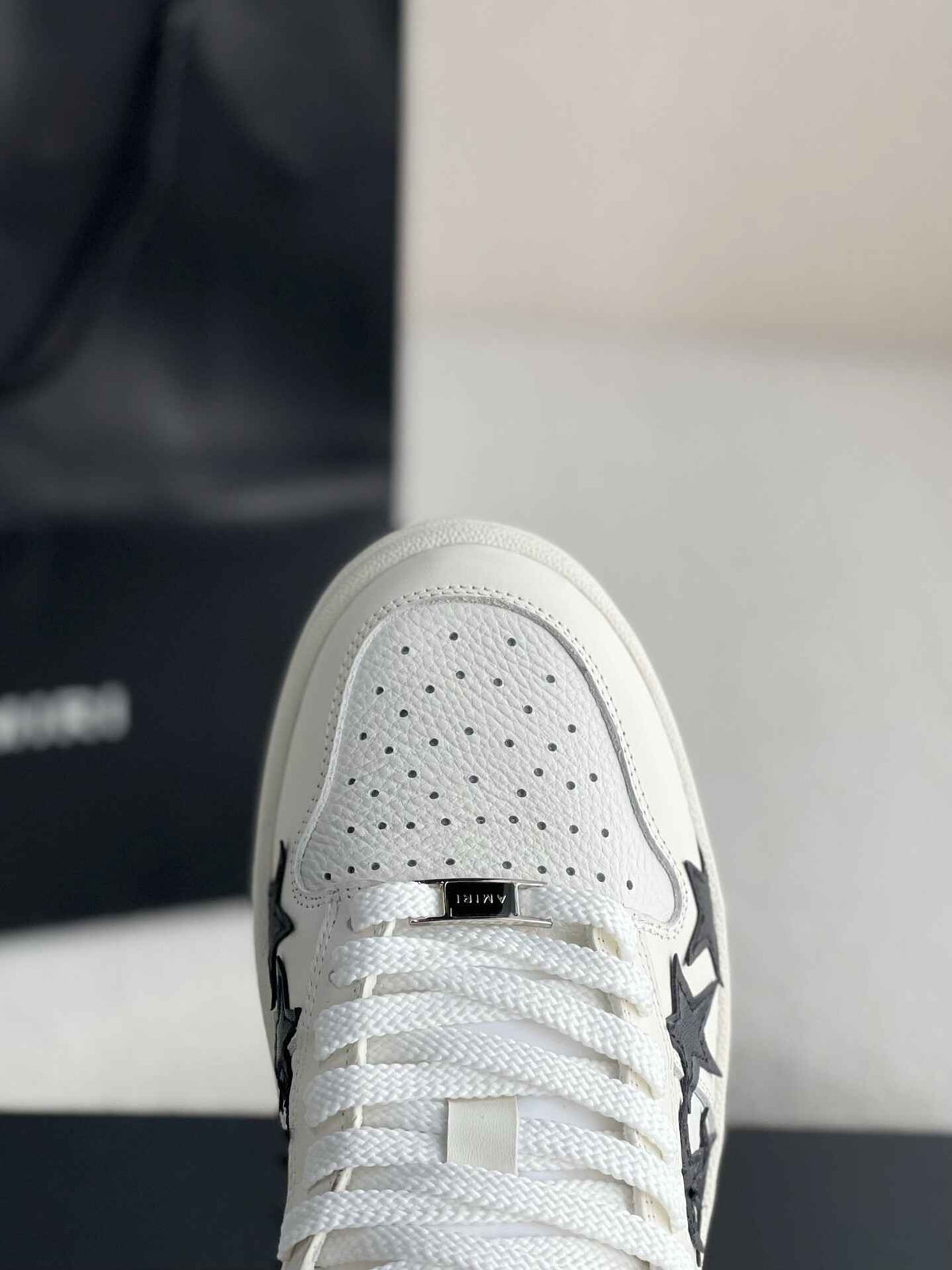 Amiri Star Burst Low – White Grained Leather & Black Stars
