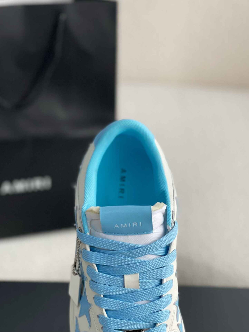 Amiri Star Burst Low – White Grained Leather & Sky Blue Stars