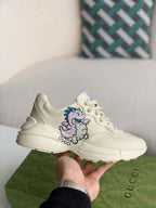 Gucci Rhyton Sneaker – Ivory Leather with Baby Dragon Print
