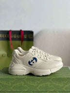 Gucci Rhyton Sneaker – Ivory Leather with Blue Interlocking G