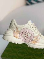 Gucci Rhyton Sneaker – Ivory Leather with Interlocking G Flame Print