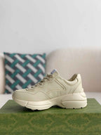 Gucci Rhyton Sneaker – Ivory Leather with Interlocking G Flame Print